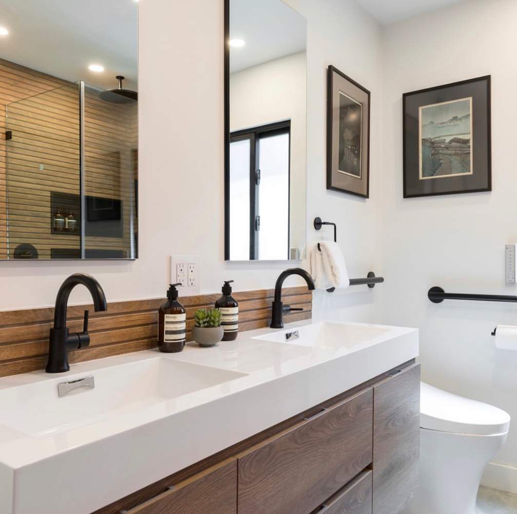 Modern bathroom with floating double vanity and wood accents