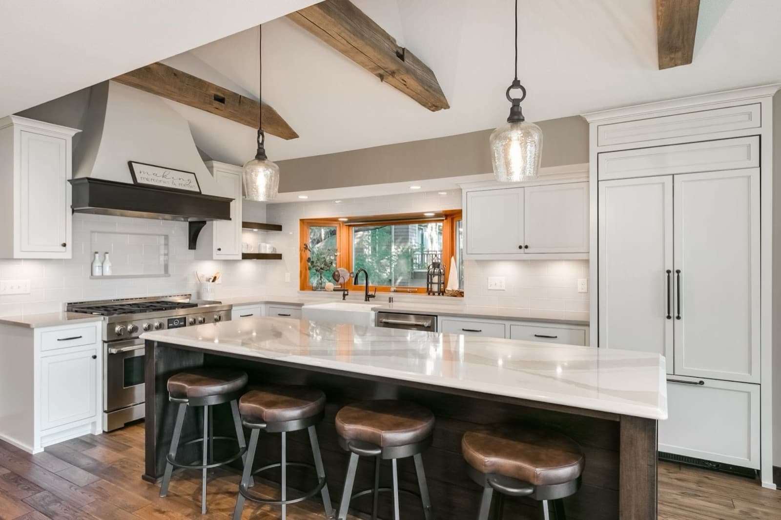 Farmhouse kitchen with island and exposed wood beams